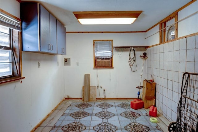 laundry area with cooling unit and crown molding