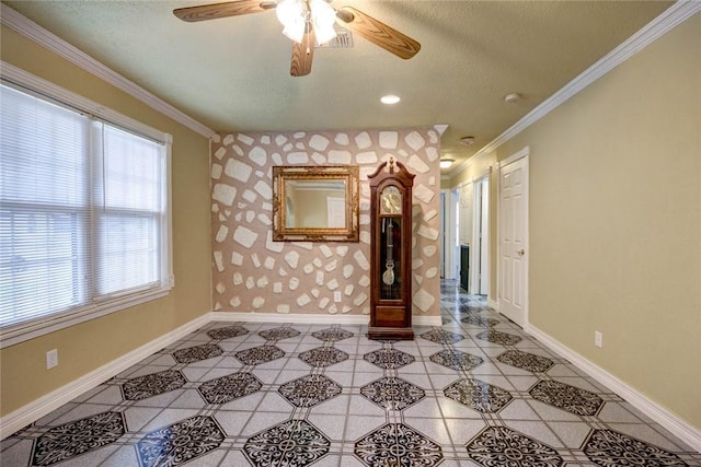 unfurnished living room with ceiling fan, plenty of natural light, and crown molding