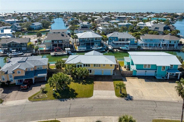 aerial view featuring a residential view and a water view