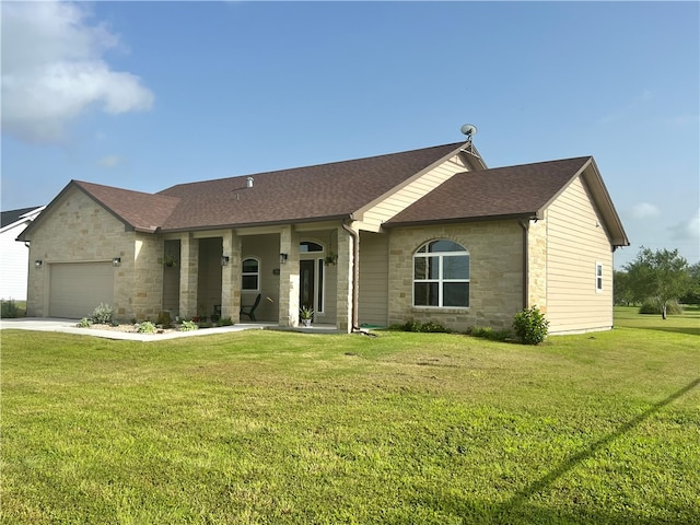 single story home featuring a front yard and a garage