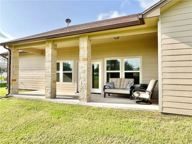 rear view of house featuring an outdoor living space and a yard