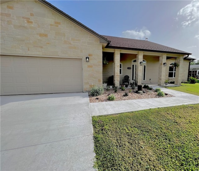 single story home featuring a front yard and a garage