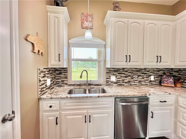 kitchen with dishwasher, white cabinets, decorative light fixtures, and sink