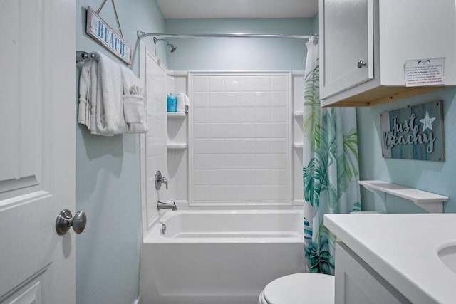 full bath with toilet, shower / bath combo with shower curtain, and vanity