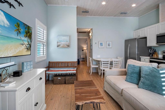 living area with wood ceiling, light wood-style flooring, visible vents, and crown molding