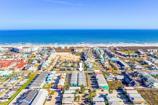 drone / aerial view with a water view and a view of the beach