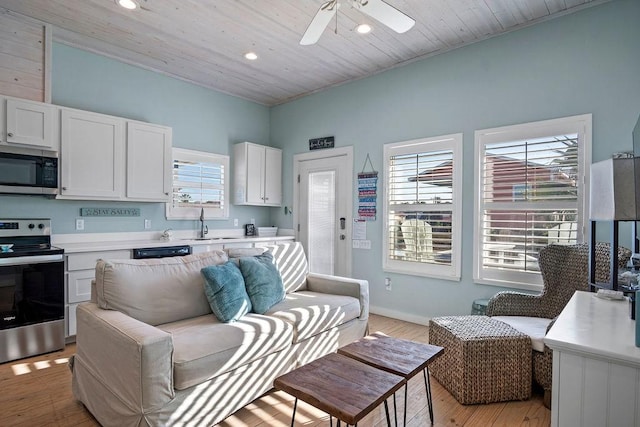 living area featuring ceiling fan, recessed lighting, wood ceiling, and light wood-style floors