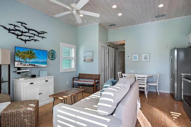 living area with ceiling fan, recessed lighting, visible vents, wood ceiling, and light wood-type flooring