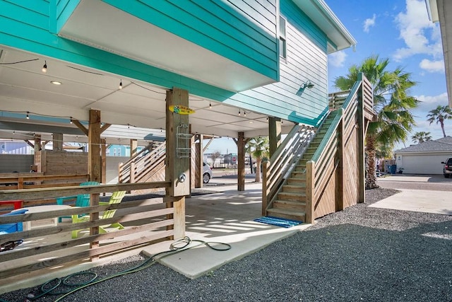 view of patio / terrace featuring stairway