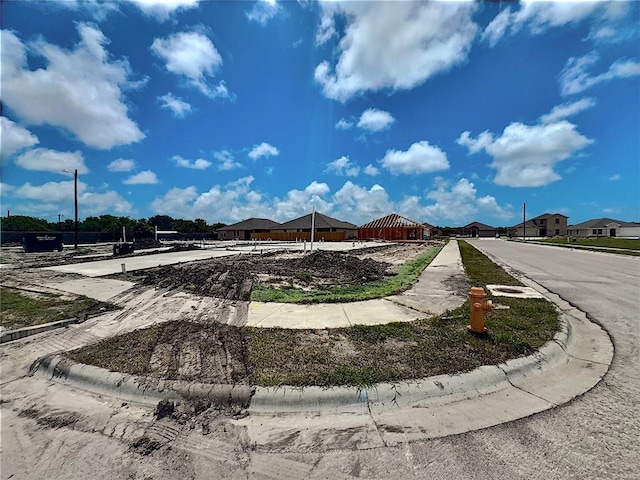 3410 Latin Ct, Corpus Christi, TX 78414 - view of asphalt street with curbs, sidewalks, and street lighting