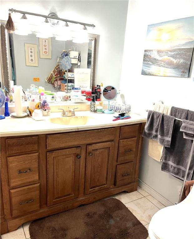 bathroom with tile patterned floors and vanity