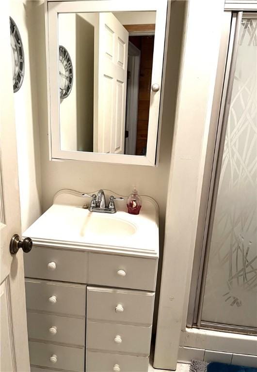 bathroom with vanity and walk in shower