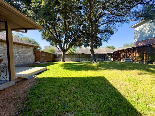 view of yard with a wooden deck