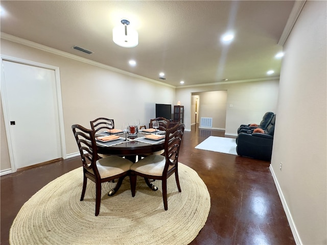 dining room featuring ornamental molding and dark hardwood / wood-style flooring