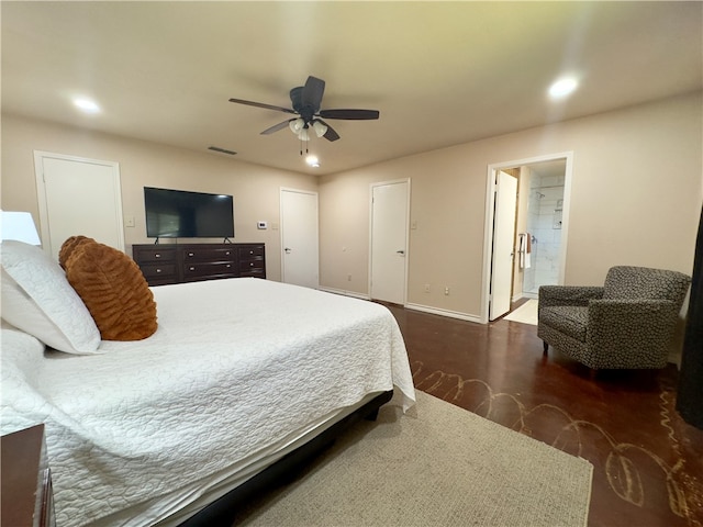 bedroom with connected bathroom, ceiling fan, and dark hardwood / wood-style flooring