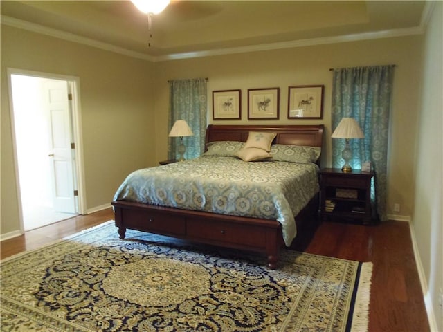 425 Seco Dr, Portland, TX 78374 - bedroom featuring wood finished floors, a tray ceiling, and ornamental molding