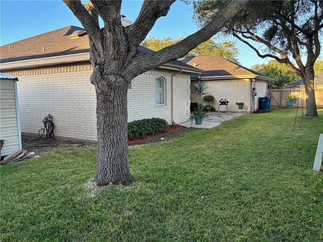 425 Seco Dr, Portland, TX 78374 - back of house with brick siding, a patio, and a shingled roof