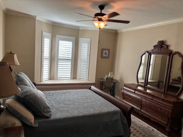 425 Seco Dr, Portland, TX 78374 - bedroom with crown molding and wood finished floors