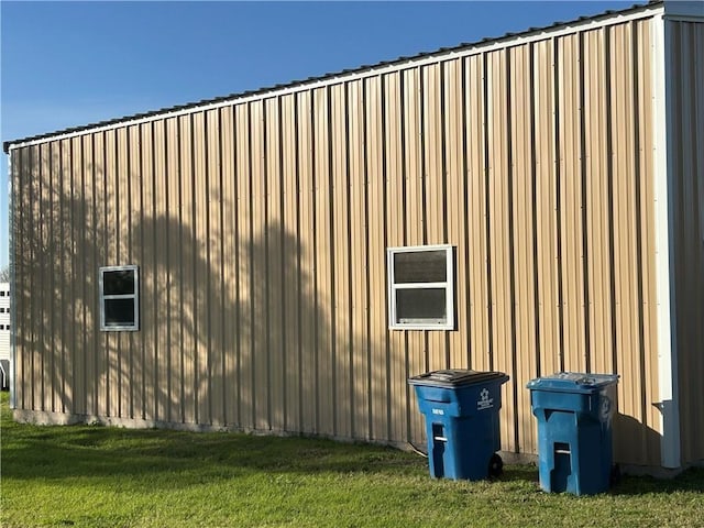 view of home's exterior with a yard