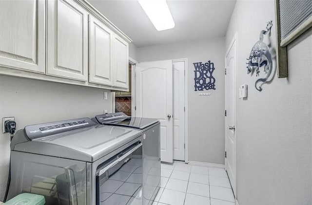 14877 Cobo De Bara, Corpus Christi, TX 78418 - washroom with cabinet space, washer and clothes dryer, and light tile patterned floors