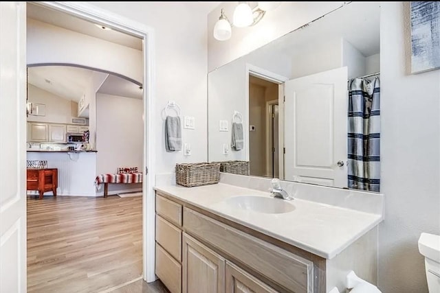 14877 Cobo De Bara, Corpus Christi, TX 78418 - bathroom featuring vanity, wood finished floors, and lofted ceiling