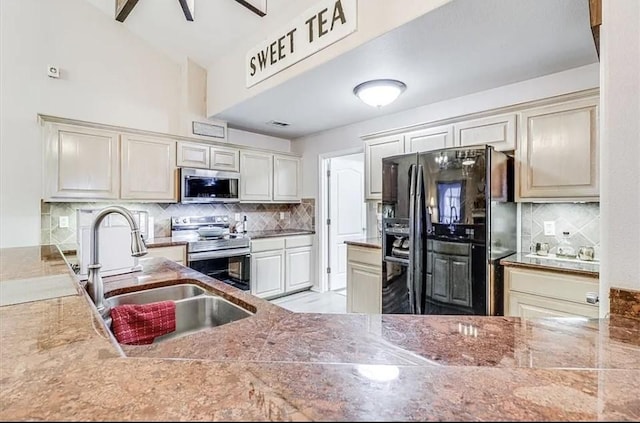 14877 Cobo De Bara, Corpus Christi, TX 78418 - kitchen with stainless steel appliances and decorative backsplash