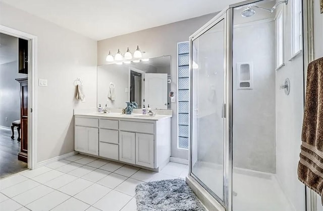 14877 Cobo De Bara, Corpus Christi, TX 78418 - bathroom featuring double vanity, a shower stall, and tile patterned flooring