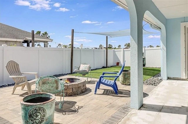 14877 Cobo De Bara, Corpus Christi, TX 78418 - fenced backyard with a fire pit and a patio