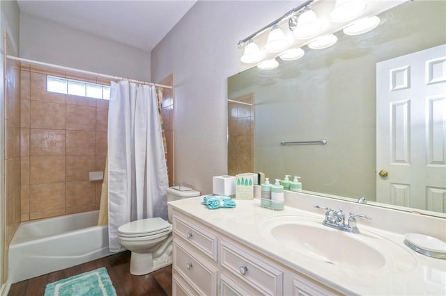 full bathroom with hardwood / wood-style floors, vanity, toilet, and shower / bath combo with shower curtain