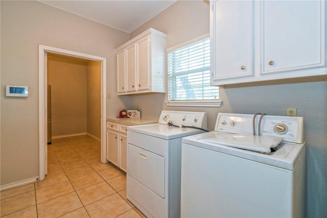 5617 Grand Lake Cir, Robstown, TX 78380 - washroom featuring independent washer and dryer, cabinet space, and light tile patterned floors