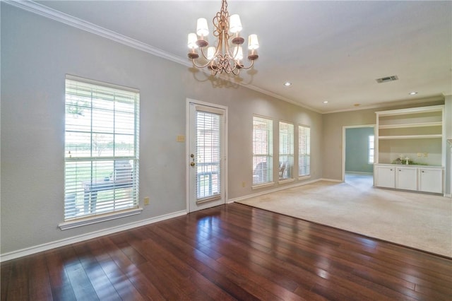 interior space featuring hardwood / wood-style floors, crown molding, and a chandelier