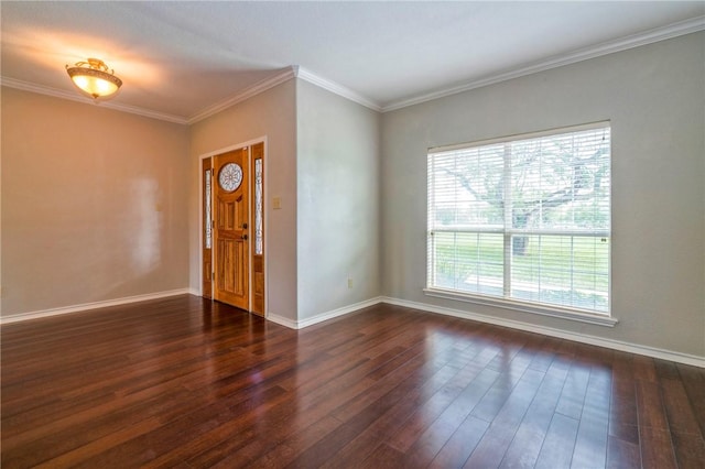 spare room featuring dark hardwood / wood-style floors, plenty of natural light, and ornamental molding