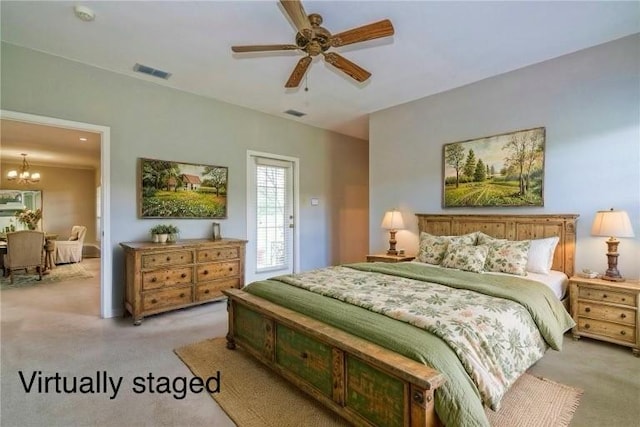 5617 Grand Lake Cir, Robstown, TX 78380 - bedroom with light colored carpet, a chandelier, and a ceiling fan