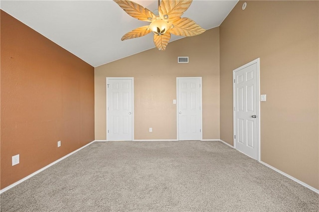 unfurnished bedroom featuring visible vents, baseboards, carpet flooring, high vaulted ceiling, and a ceiling fan