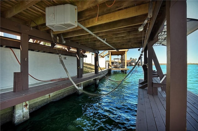 view of dock with a water view and boat lift