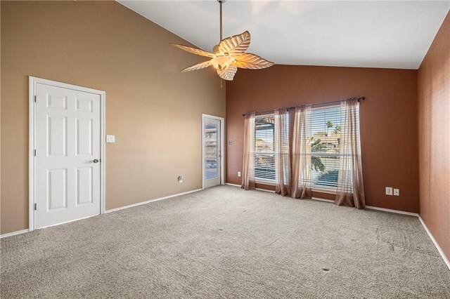 unfurnished room featuring high vaulted ceiling, carpet, baseboards, and ceiling fan