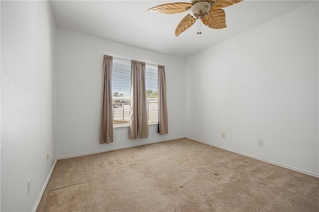 empty room with carpet flooring and ceiling fan