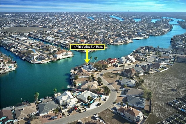 aerial view with a water view and a residential view