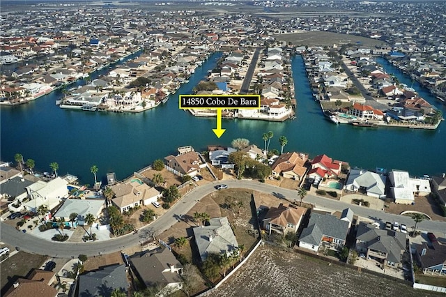 aerial view with a residential view and a water view