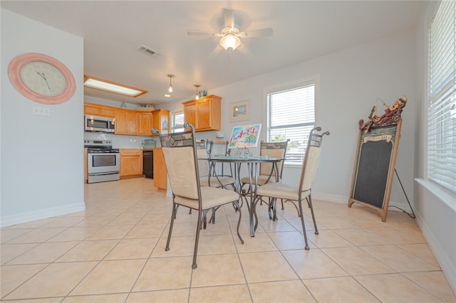 tiled dining room with ceiling fan