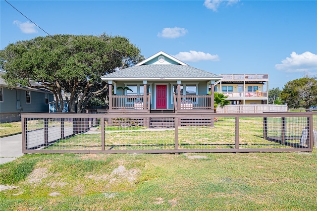 bungalow-style house with covered porch and a front lawn