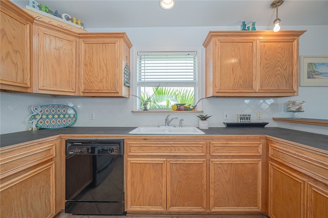 kitchen featuring decorative backsplash, decorative light fixtures, sink, and black dishwasher