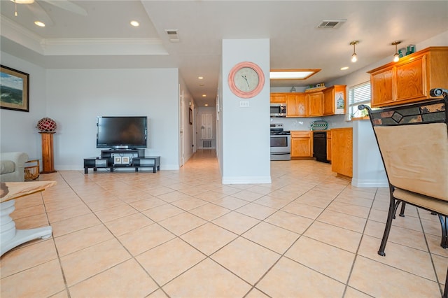 kitchen with ceiling fan, appliances with stainless steel finishes, light tile patterned floors, and ornamental molding