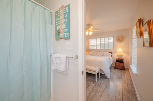 bedroom with hardwood / wood-style floors and ceiling fan