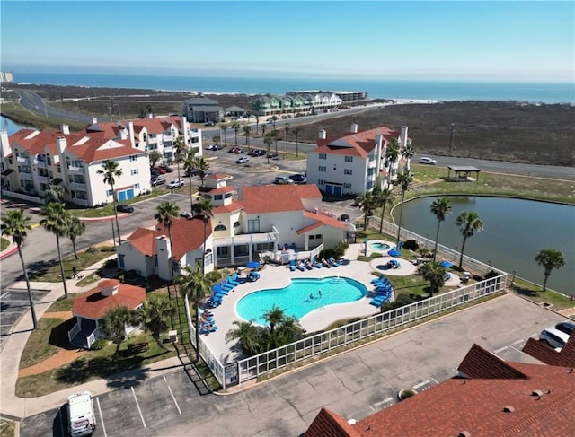 birds eye view of property featuring a water view and a residential view