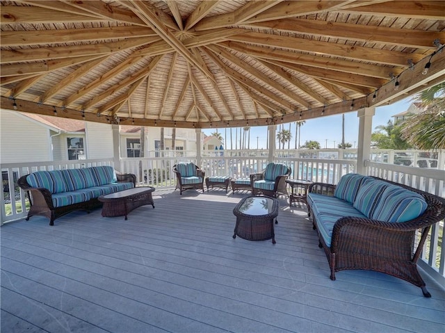 deck featuring outdoor lounge area and a gazebo