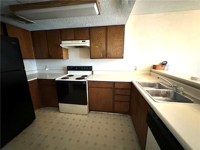 3402 Ocean Dr Unit 8, Corpus Christi, TX 78411 - kitchen with freestanding refrigerator, range with electric stovetop, a sink, under cabinet range hood, and dishwashing machine