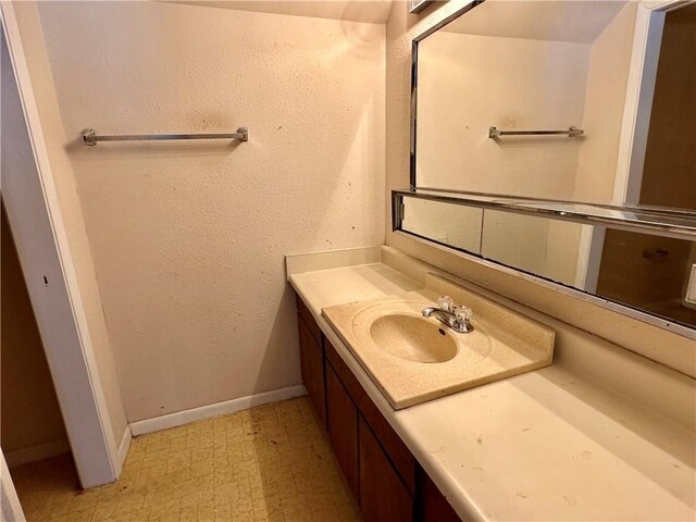 3402 Ocean Dr Unit 8, Corpus Christi, TX 78411 - bathroom with tile patterned floors, vanity, and baseboards