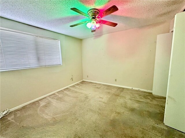3402 Ocean Dr Unit 8, Corpus Christi, TX 78411 - spare room with ceiling fan, carpet flooring, a textured ceiling, and baseboards