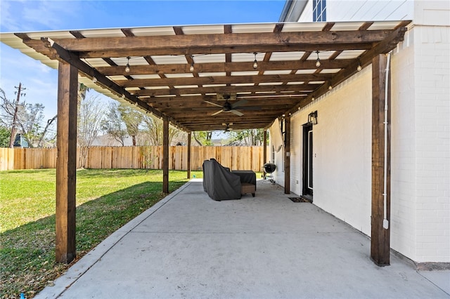 view of patio / terrace with a ceiling fan and fence